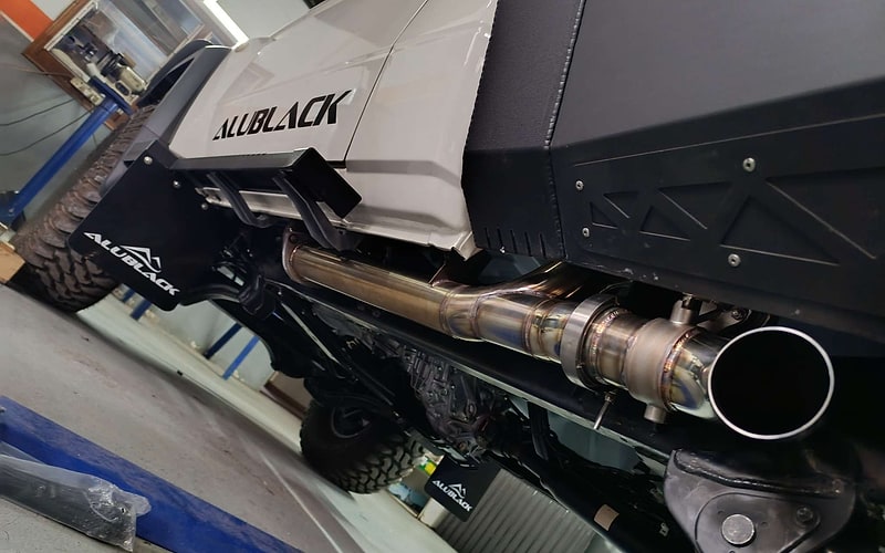 Custom branded side-exit exhaust fitted under a 4x4